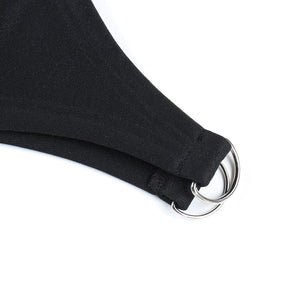 Black dress ring accent close-up