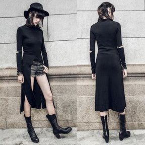 Paired views of the black long-sleeve layering dress styled with separate shorts, boots and a hat, showing the high front opening and plain long back panel.