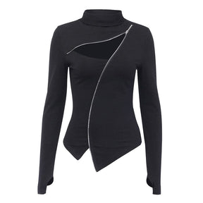 Black long-sleeve turtleneck isolated on white, with a diagonal silver-tone zip, chest cutout and asymmetrical pointed hem.