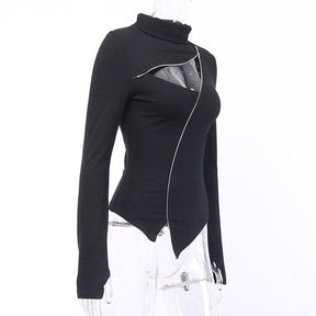 Angled mannequin view of the fitted black turtleneck, showing the chest opening, diagonal zip and uneven front hem.