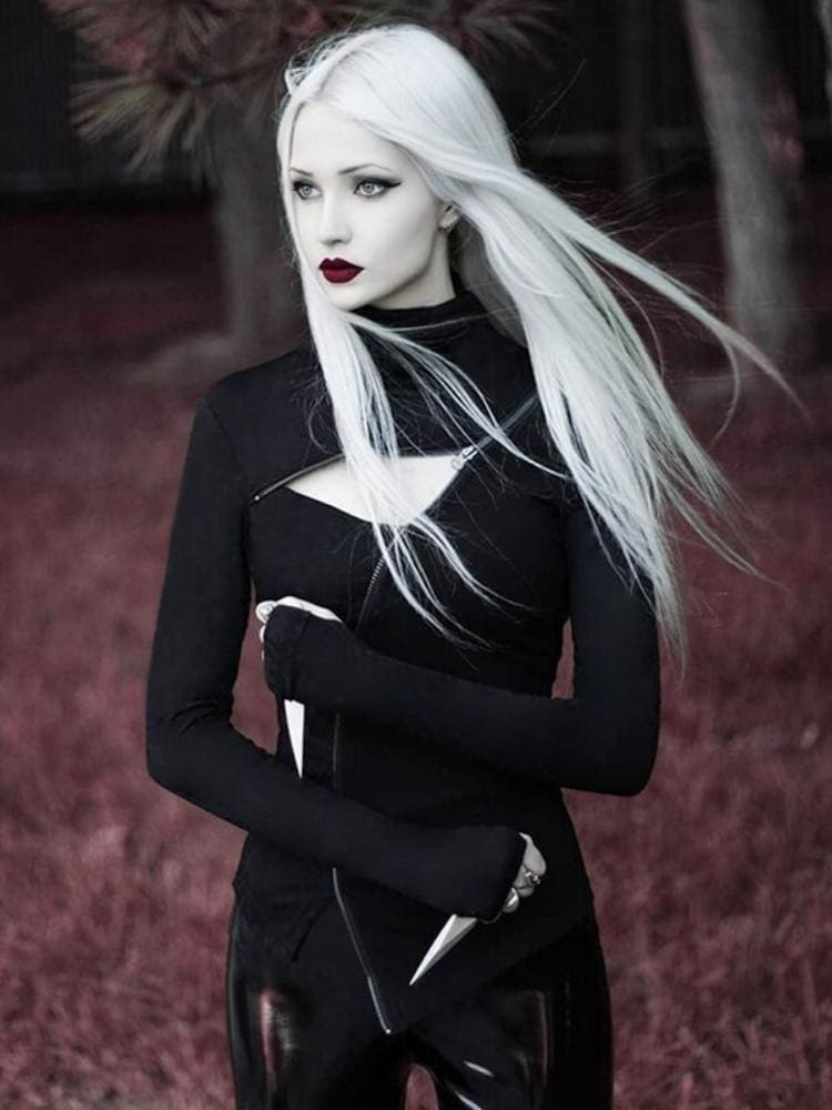 Black Witchy Ninja turtleneck styled outdoors, with an asymmetric silver-tone zip, chest cutout and pointed front hem.