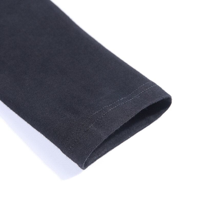 Close view of the black sleeve end and its stitched cuff on the Witchy Ninja turtleneck.