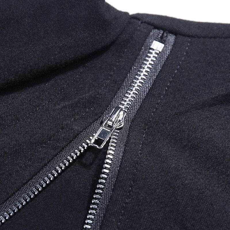 Close-up of the zipper slider and silver-tone teeth beside the black turtleneck collar.