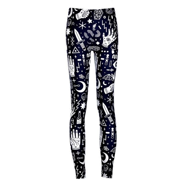 Front product view of slim black leggings with densely arranged white hands, eyes, crescent moons and geometric symbols running down both legs.