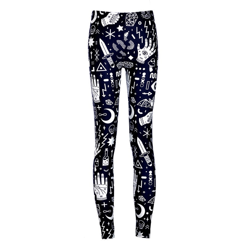 Black full-length witchy leggings covered in white palmistry hands, eyes, moons, crystals and dagger illustrations, shown from the front against white.