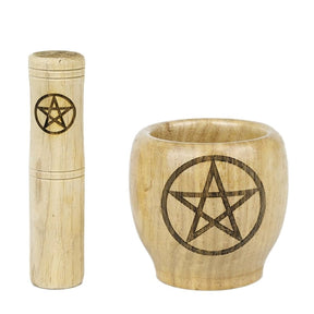 Wooden mortar bowl and pestle side by side