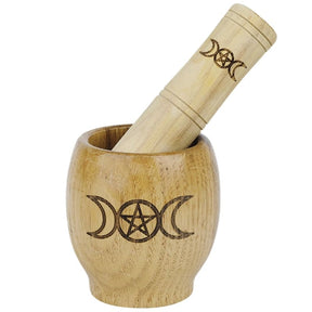 Triple moon wooden mortar and pestle isolated
