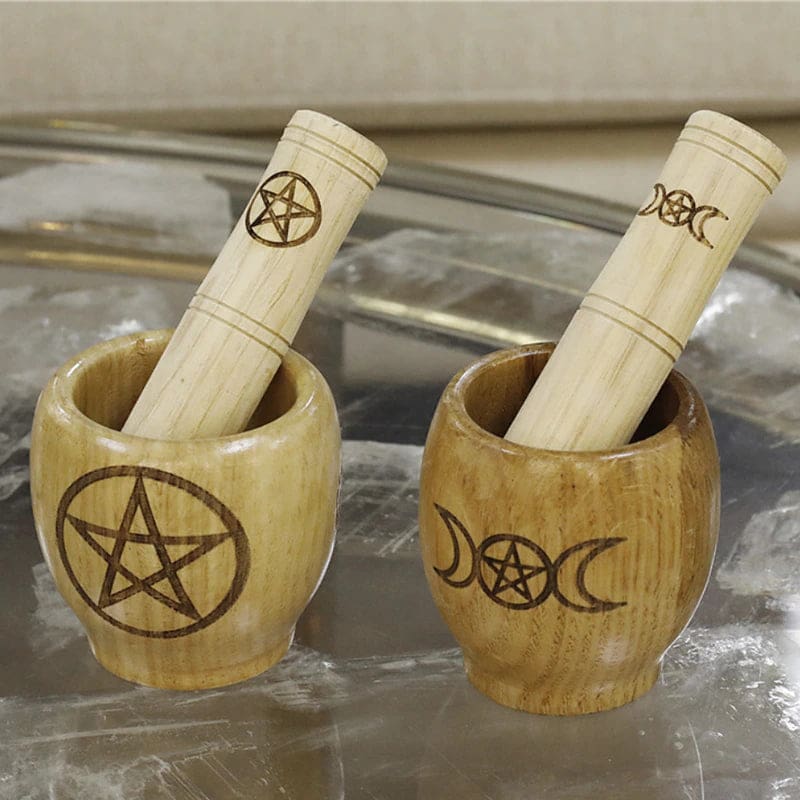 Two wooden mortar sets with separate pestles