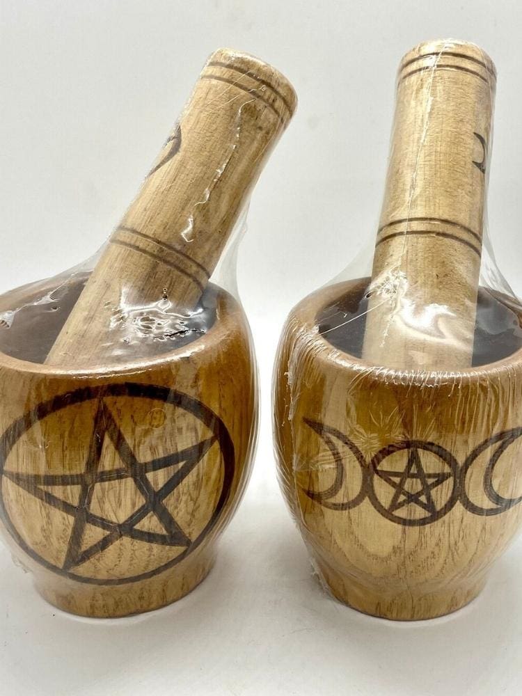 Two wooden mortar sets wrapped for storage