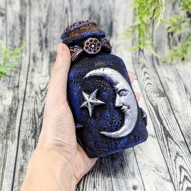 Blue moon bottle full held view
