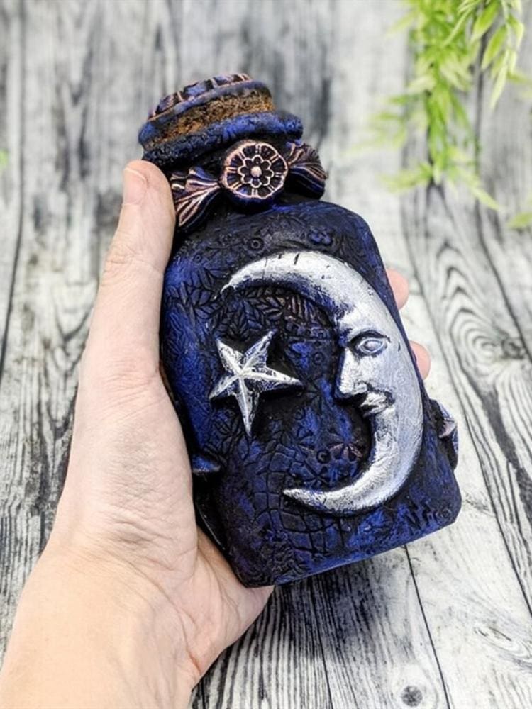 Blue moon ornamental bottle held