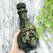 Green leaf ornamental bottle held