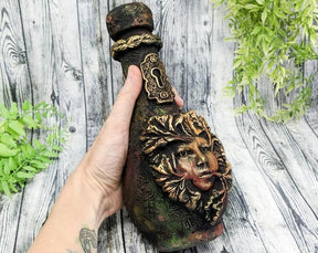 Red woodland ornamental bottle held