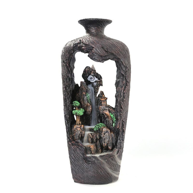 Closer isolated view of the cutaway vase burner, with miniature trees and pavilions among the stepped brown rocks.