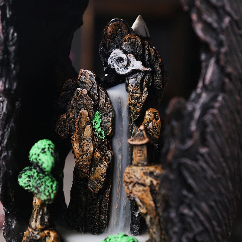 Close crop of the woodland burner’s inner rock ledges and miniature trees beneath the upper cone area.