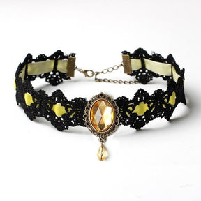 Black lace choker with an ornate oval centerpiece and hanging teardrop in the Yellow ribbon and jewel option.